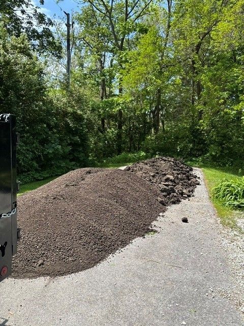 Loaded truck bed with mixed construction debris during hauling job