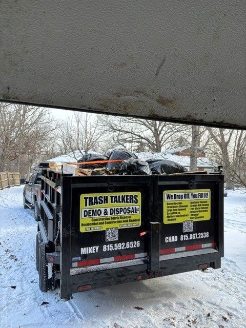 Trash Talkers crew offloading construction waste and appliances at a Kankakee County disposal facility