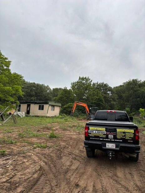 Trash Talkers demolition truck and equipment at a rural Kankakee County job site in Illinois