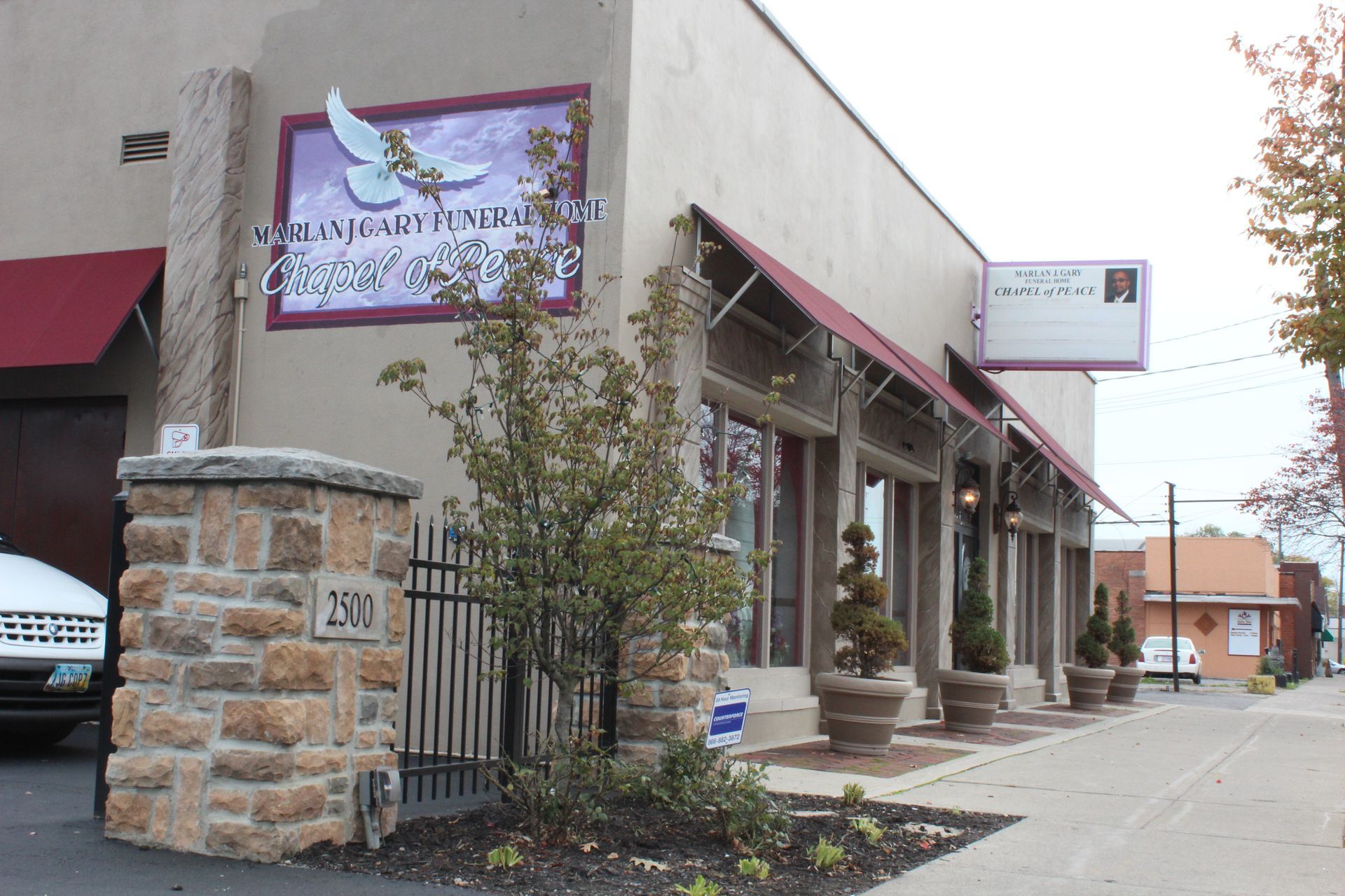 A building with a sign on the side that says ' amanda ' on it