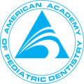 American Academy of Pediatric Dentistry logo in blue and white, with circular text around a stylized tooth and smile icon