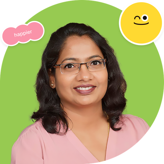Smiling woman with glasses on a green circle background, with a pink āhappierā sticker and yellow smiley icon