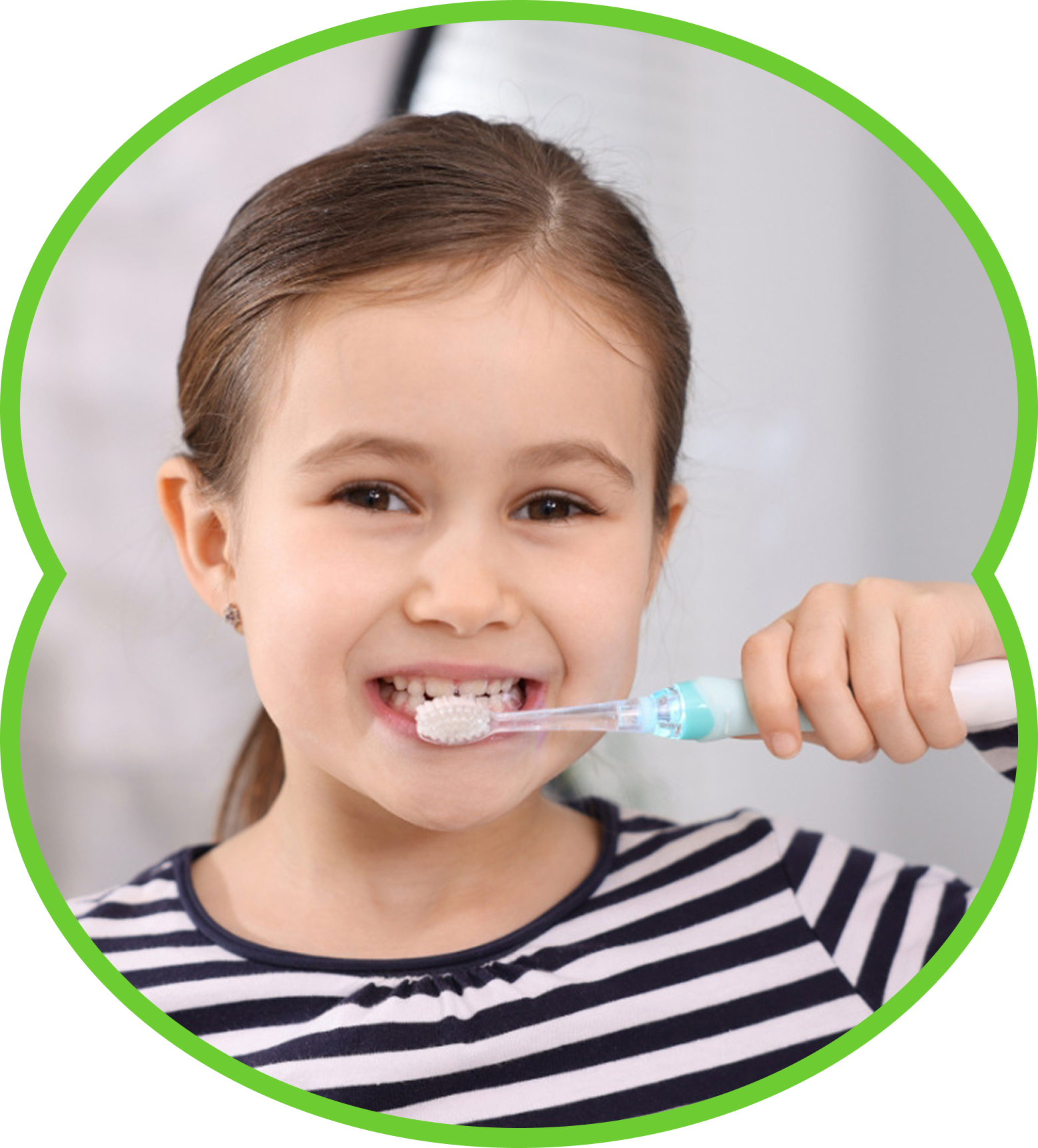 Child brushing teeth with a blue toothbrush, smiling in a striped shirt.