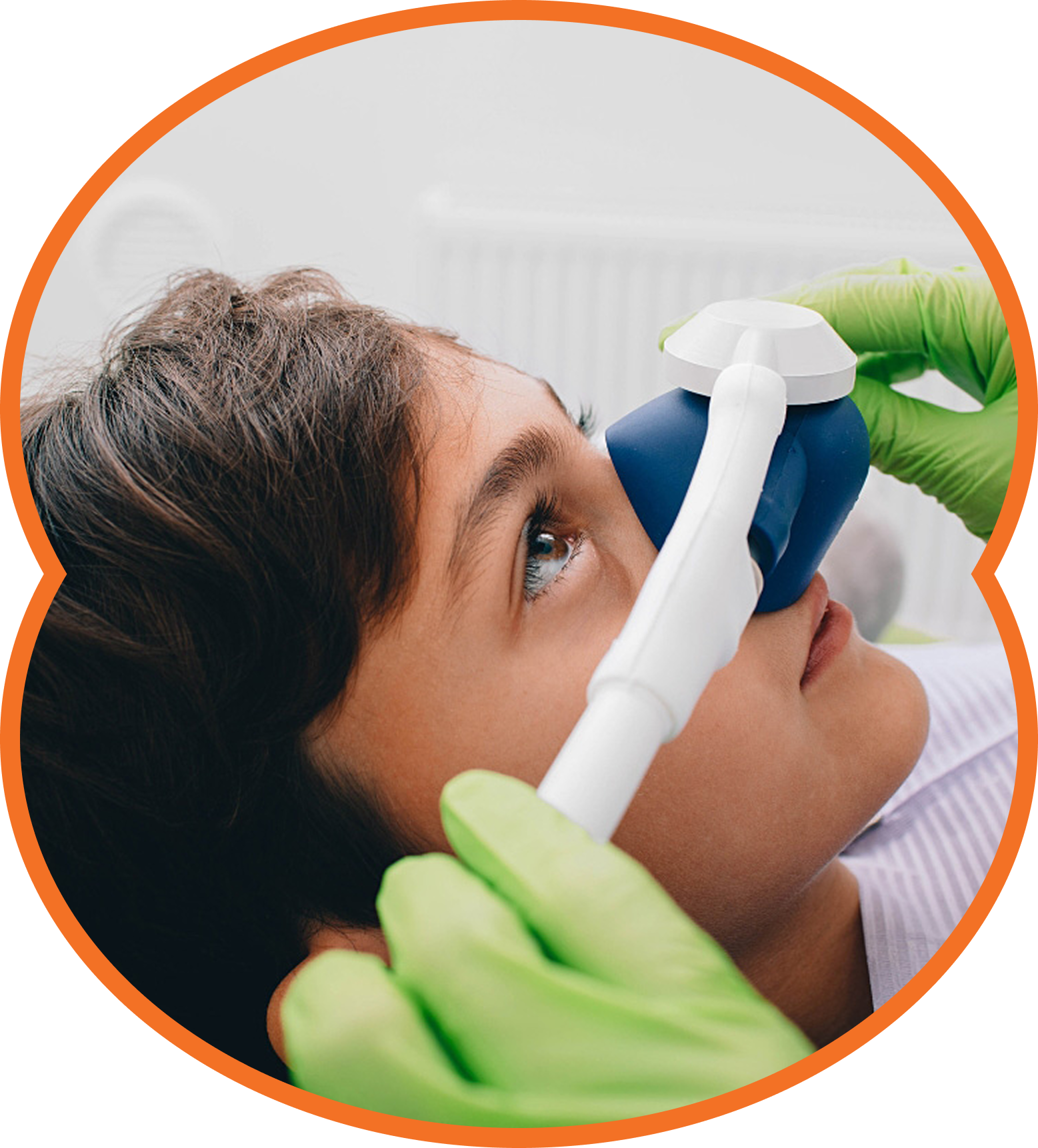 Healthcare worker cleaning a patient’s nose with a spray while wearing green gloves