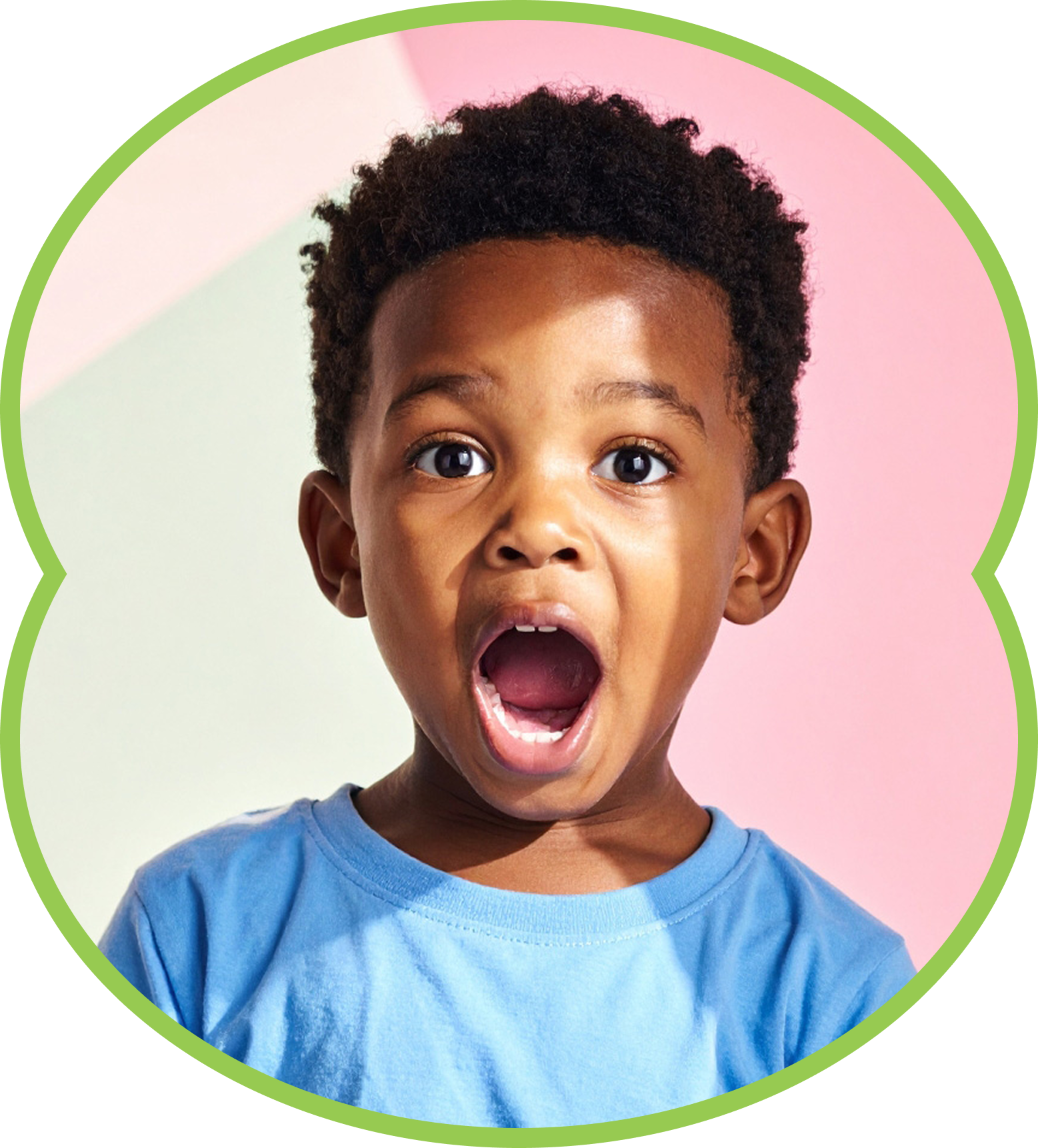 Child with wide open mouth and surprised expression on a pink background, wearing a blue shirt.