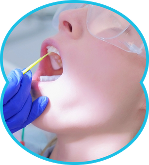 Dental professional swabbing a patientās open mouth with a cotton applicator
