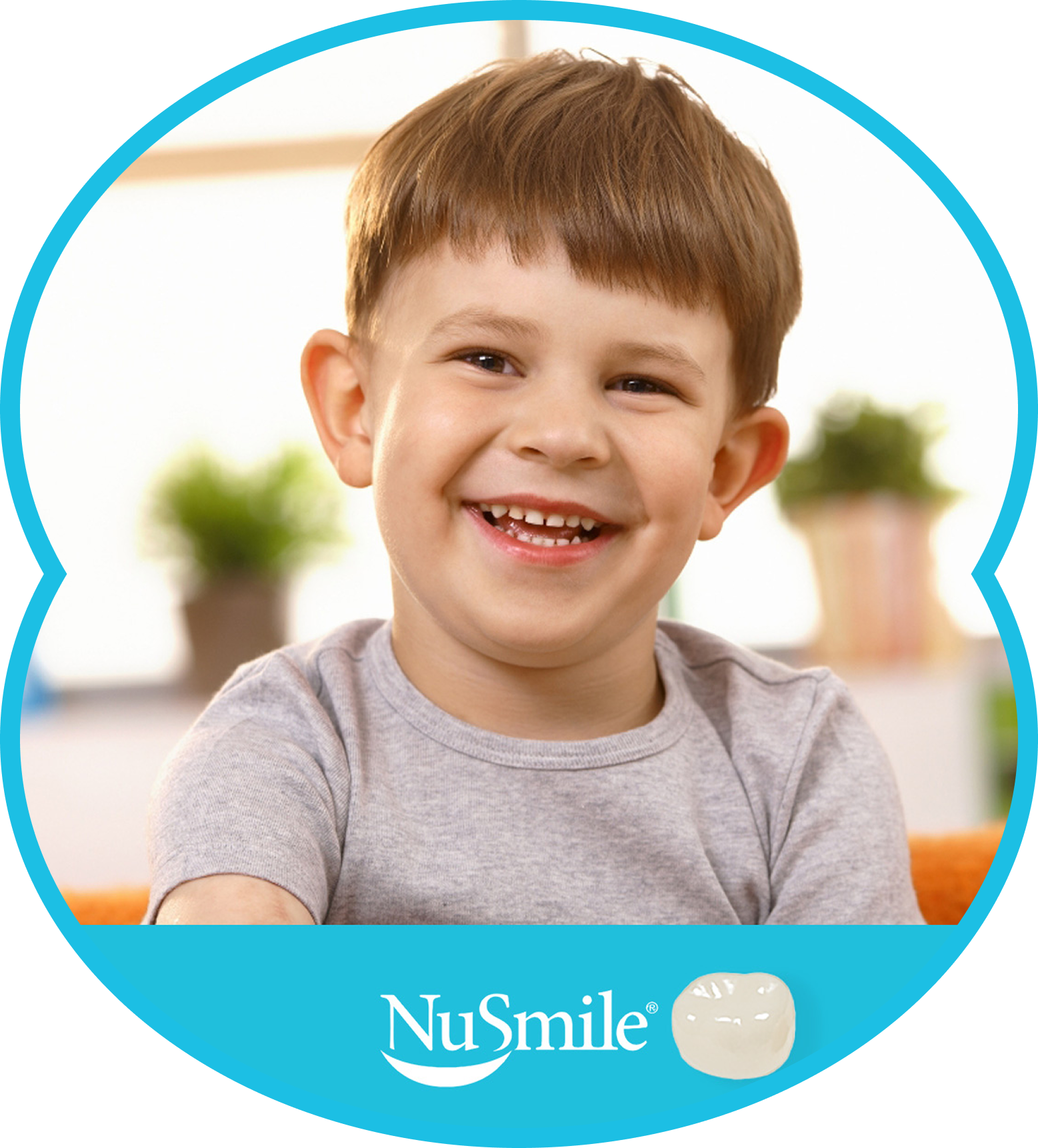 Smiling child in a gray shirt on a blue NuSmile background