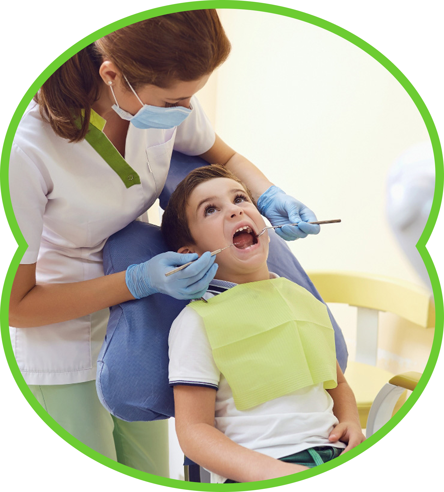 Dentist examining a child in a dental chair, wearing masks and blue gloves.