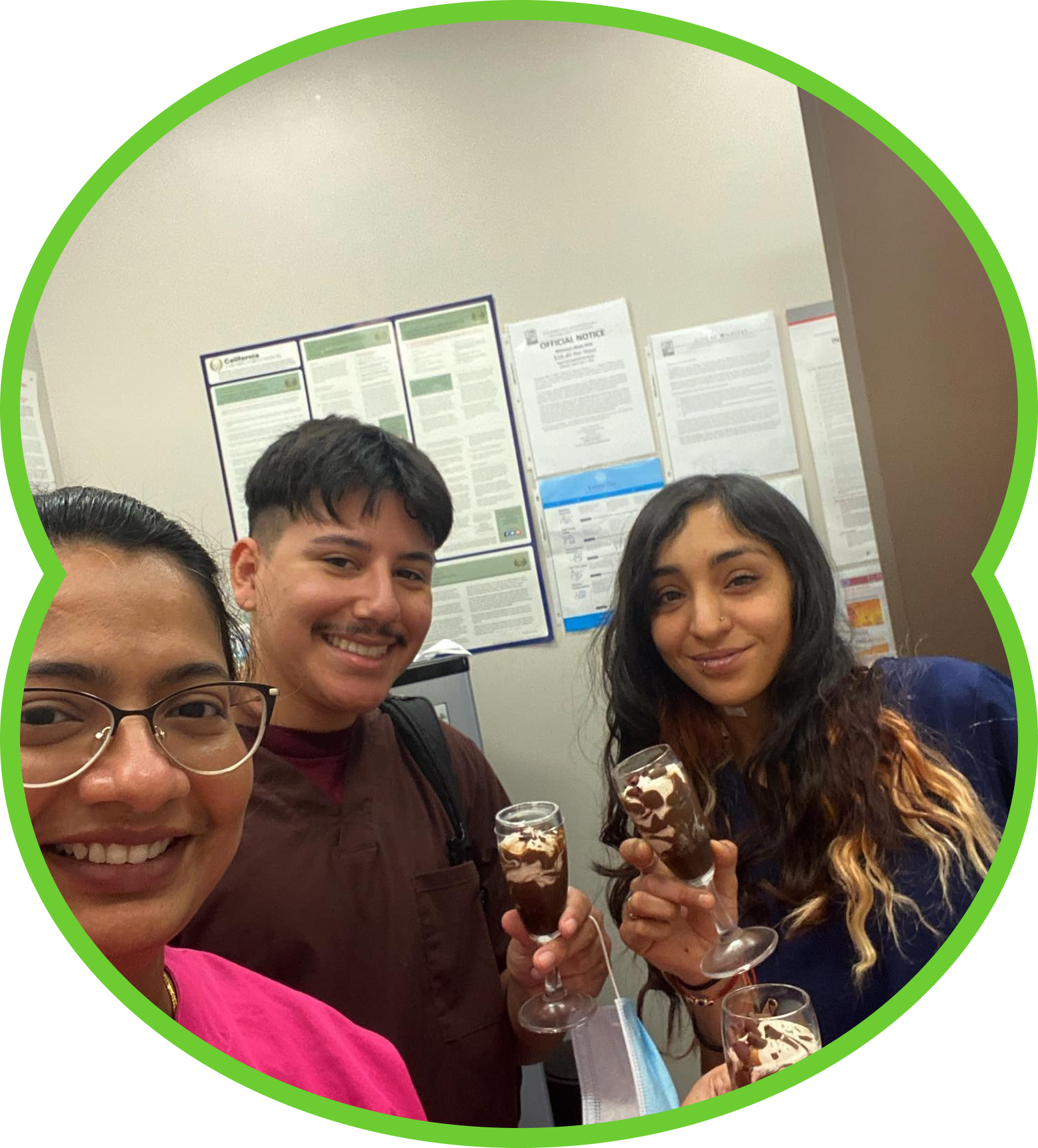 Three smiling coworkers holding ice cream cups in an office, framed by a green circle.