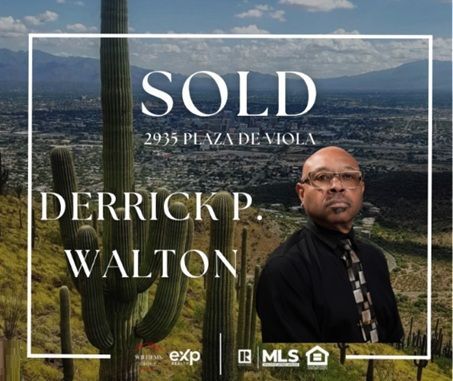 Sold real estate sign for 2935 Plaza de Avila with Derrick P. Walton over a desert city skyline.