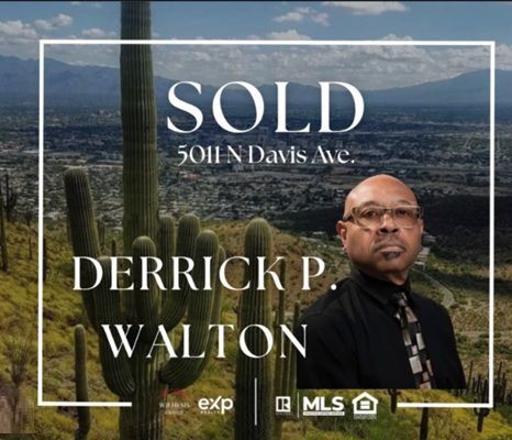 Sold real estate sign for 5011 Davis Ave with Derrick P. Walton over a desert city view