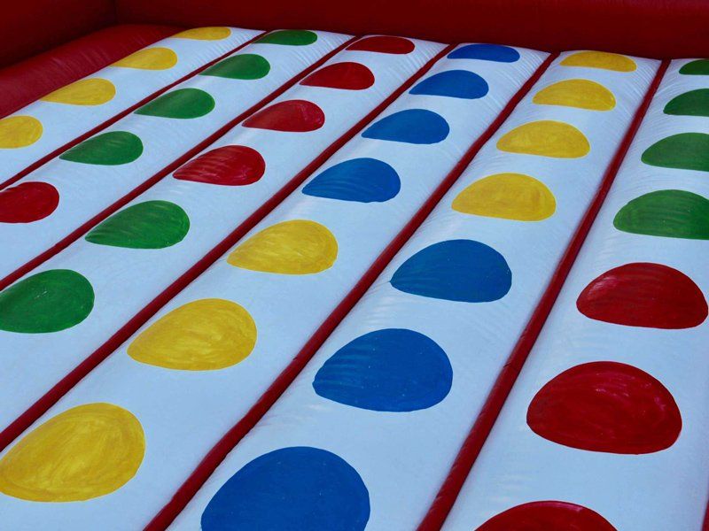 Colourful circles on inflatable twister — Inflatable Activities in Gympie, QLD