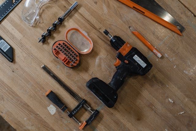 wooden-workbench-with-neatly-arranged-tools-and-power-drill