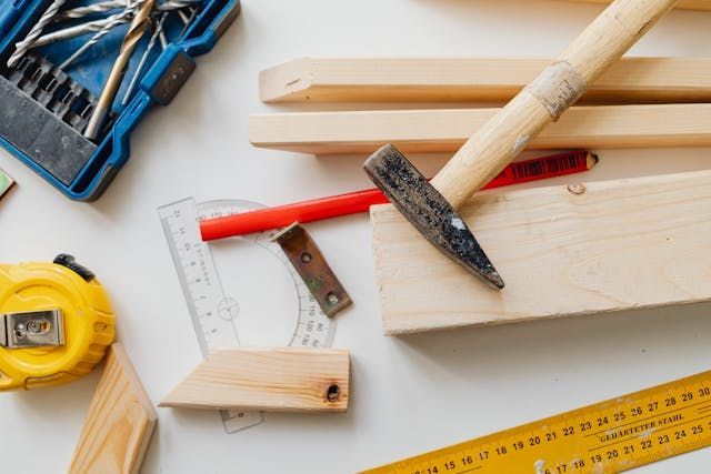 woodworking-tools-and-materials-on-white-surface