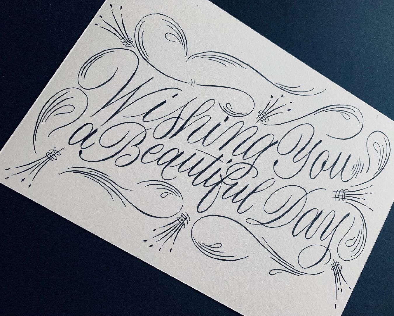 Greeting card written out using a black Pentel Touch Sign Brush Pen with the message 'Wishing you a beautiful day'.