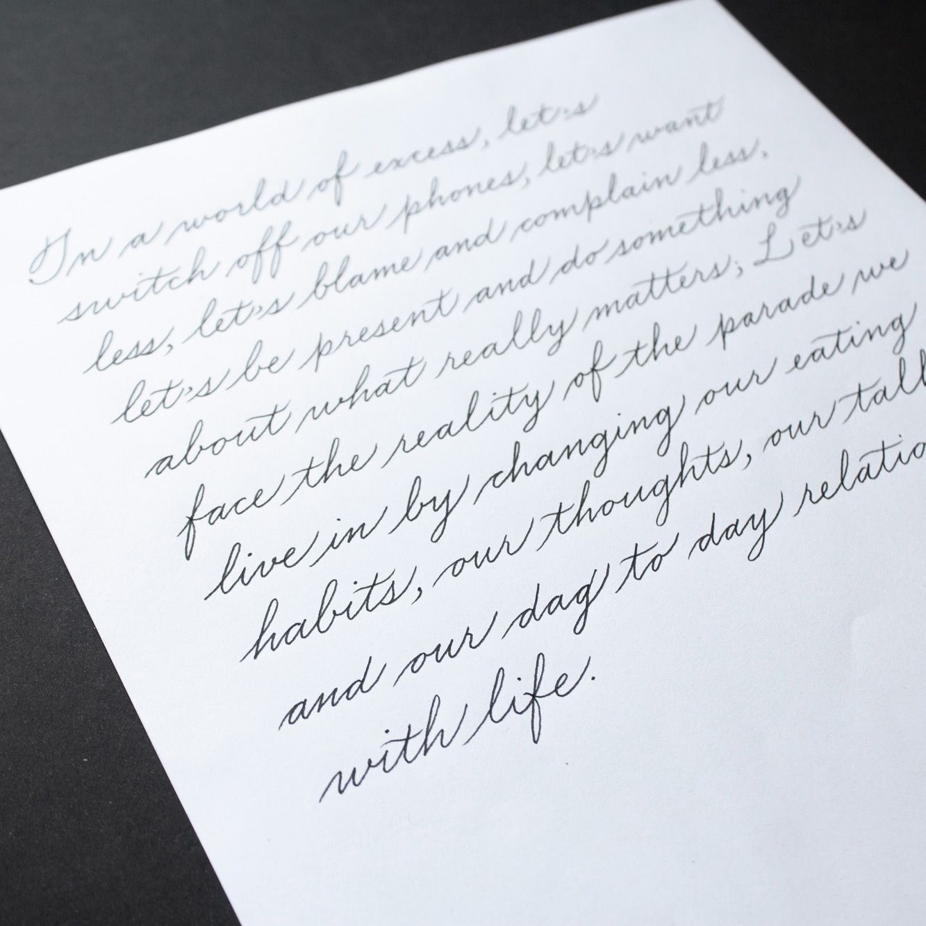 A photograph of several pages with the message 