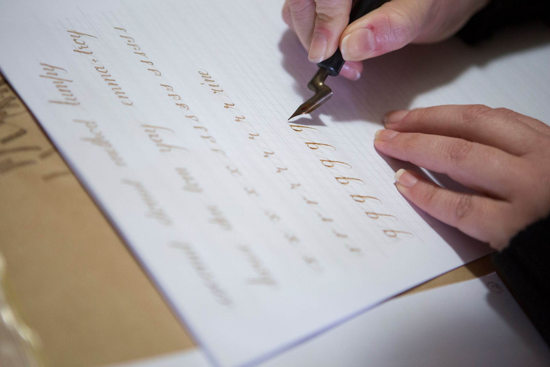 A student at Rotson Studios in Melbourne writing Copperplate Calligraphy.