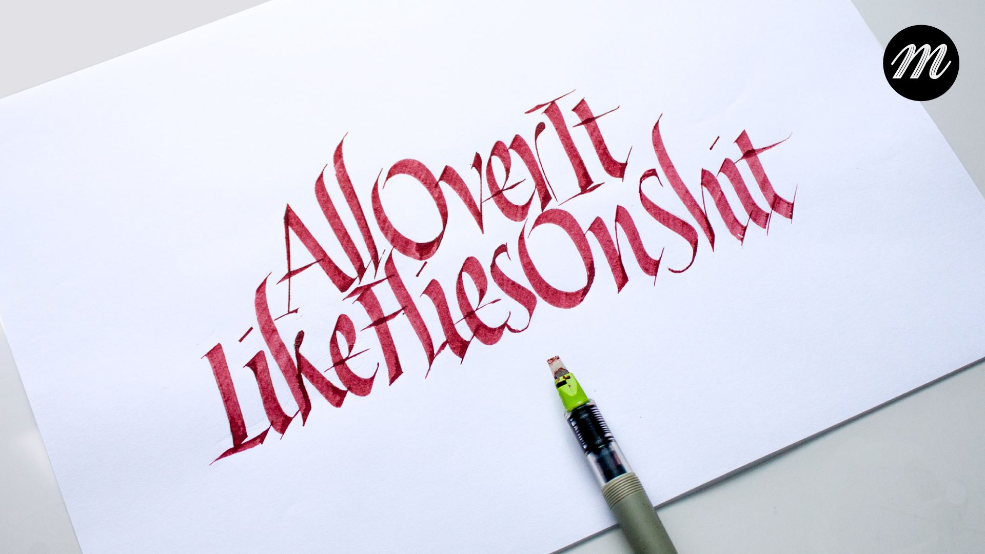 Italic calligraphy design with the message 'All over it like flies on shit'.