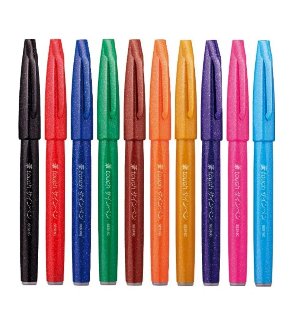 Photo of ten Pentel Touch Sign Brush pens of different colours.