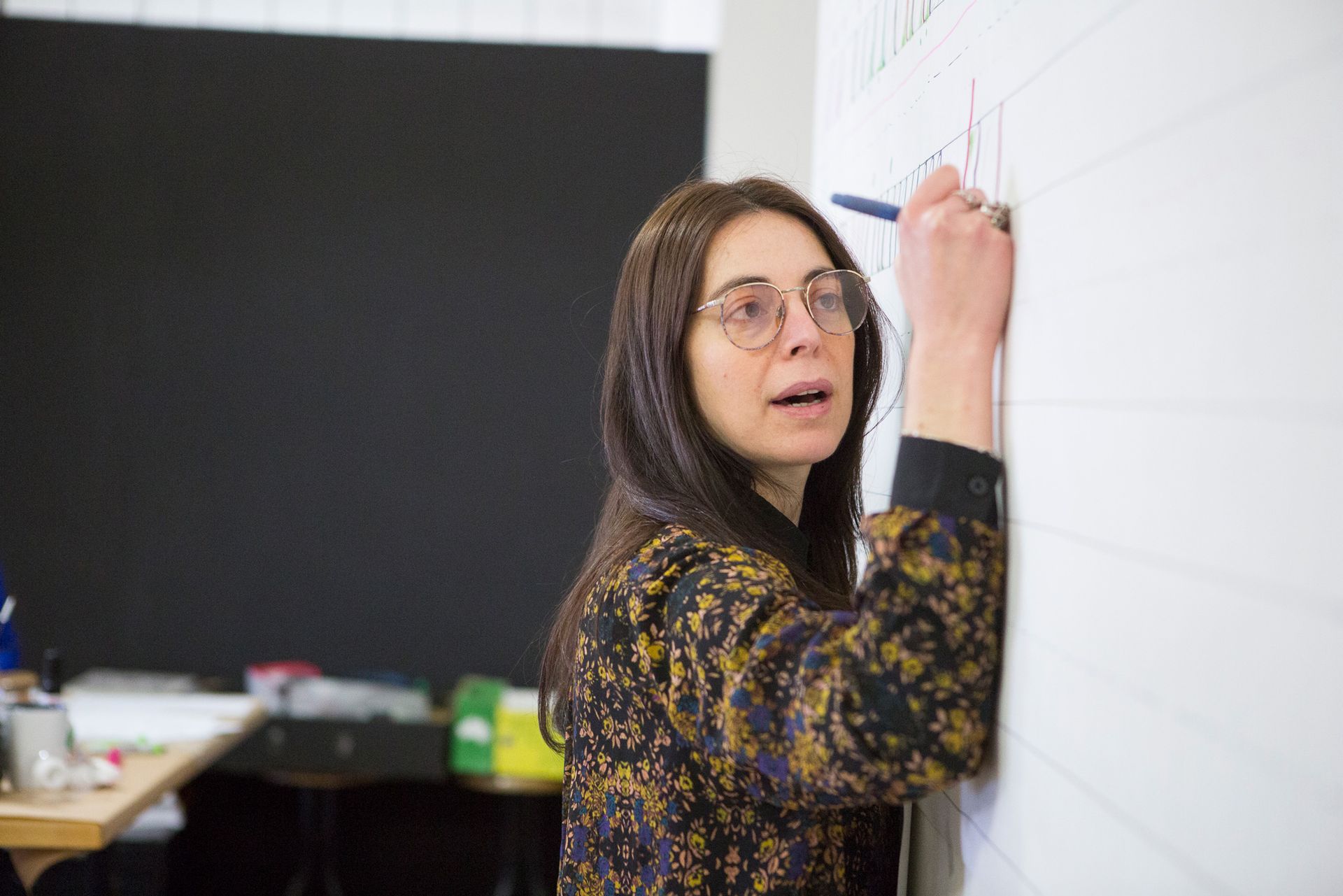 Portrait of Maria Montes writing on the wall at Rotson Studios in Naarm (Melbourne, Australia).