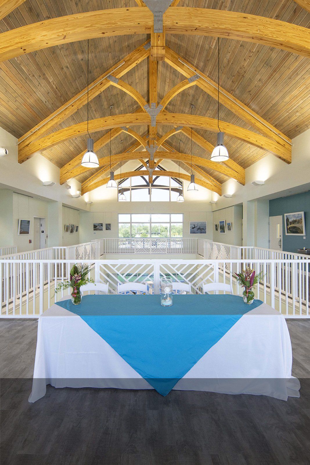 There is a table with a blue tablecloth in the middle of the room.