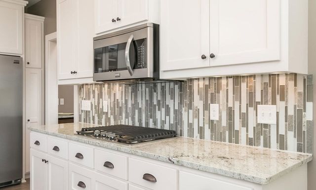 Transitional Kitchen Remodel by Chain Of Lakes Granite Inc project photo 2