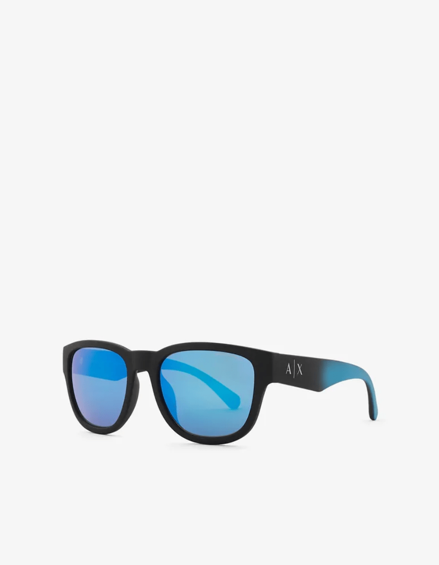 A pair of sunglasses with blue lenses on a white background.