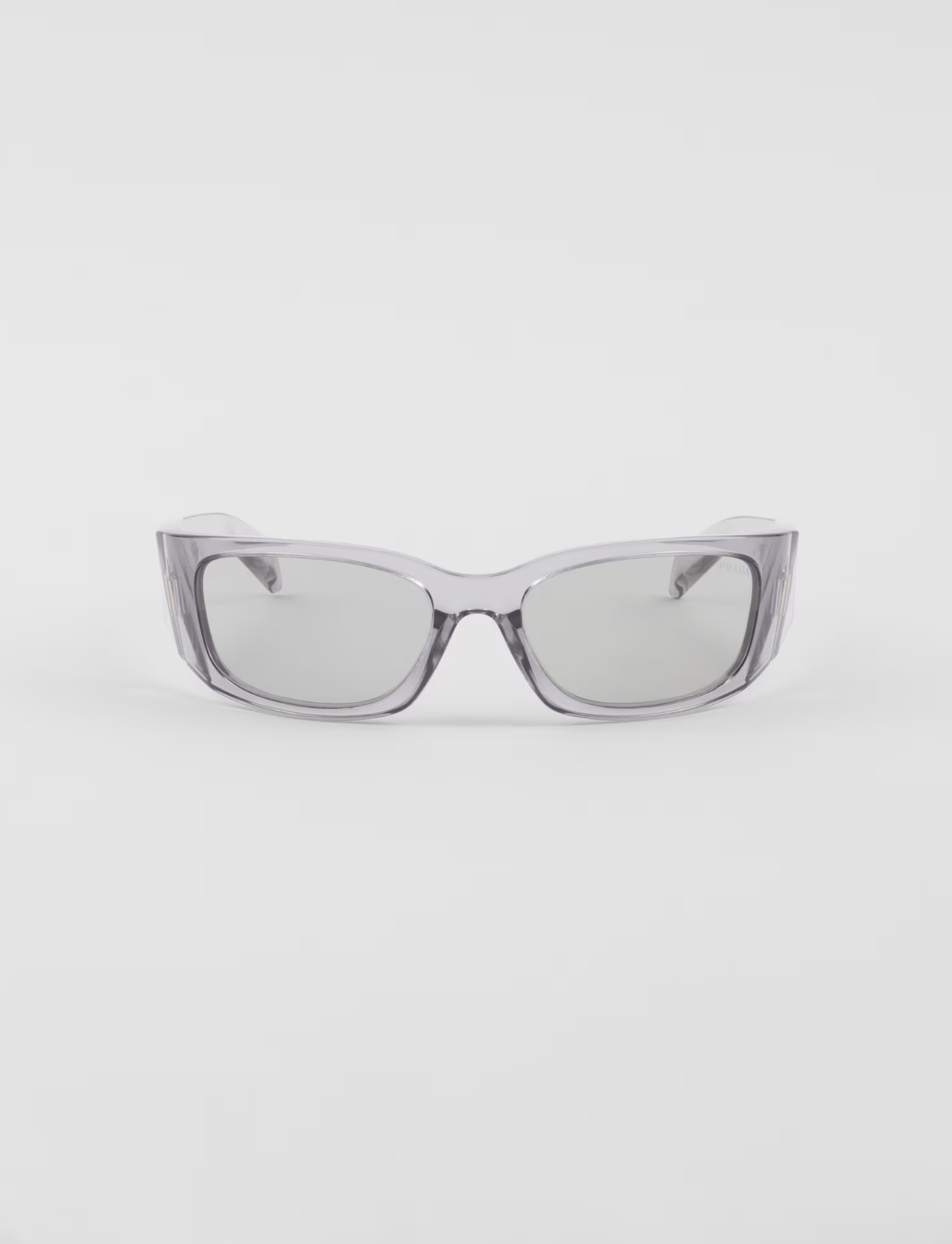 A pair of sunglasses with a clear frame on a white background.