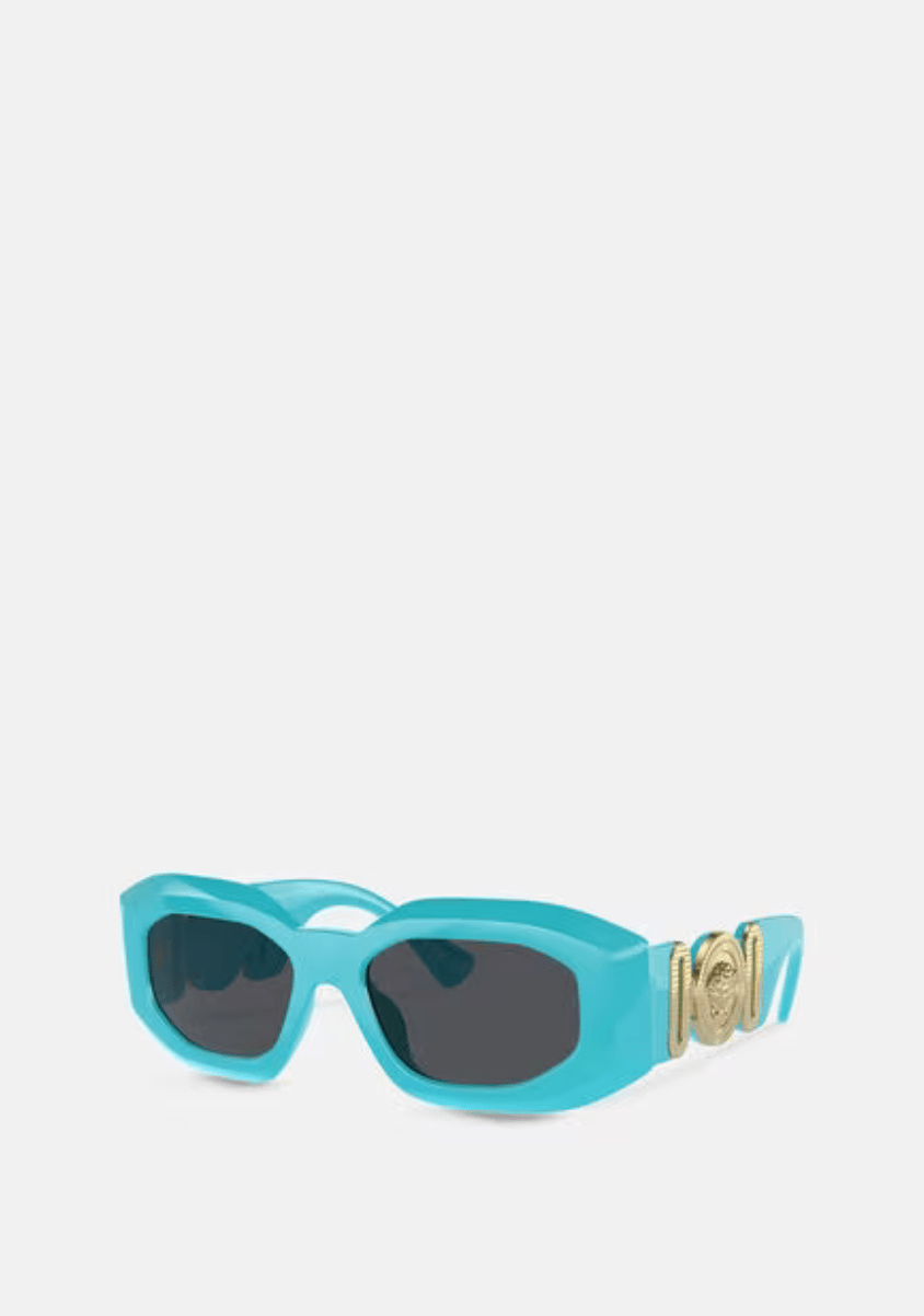A pair of blue versace sunglasses on a white background.