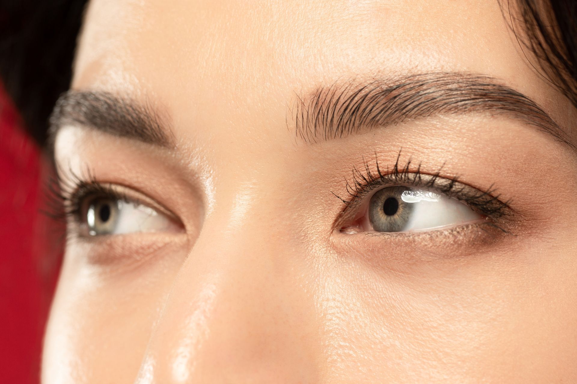 A close up of a woman 's eyes with mascara on.