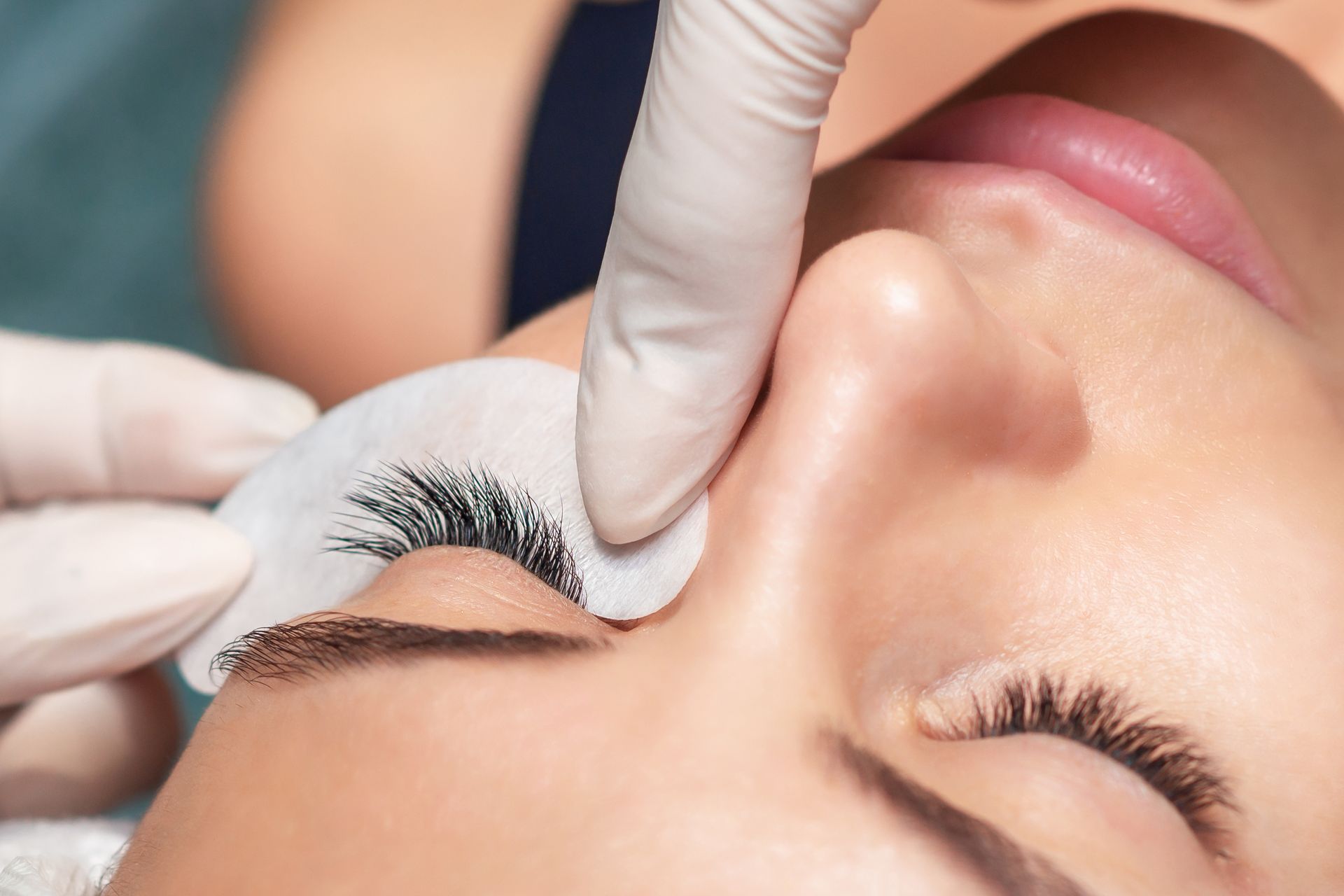 A close up of a woman getting eyelash extensions.