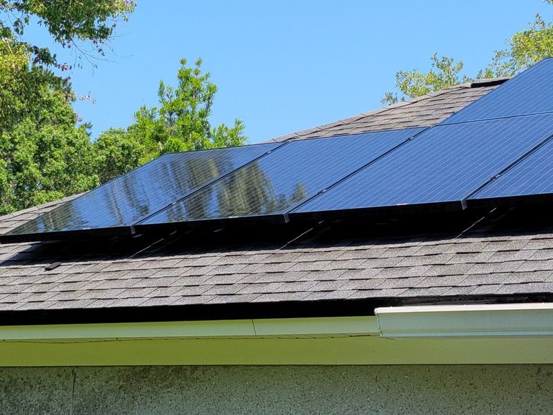 A roof with a lot of solar panels on it