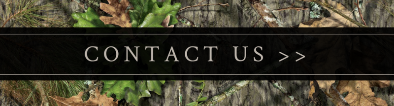 “Contact Us >>” text on a black banner over a camouflage background