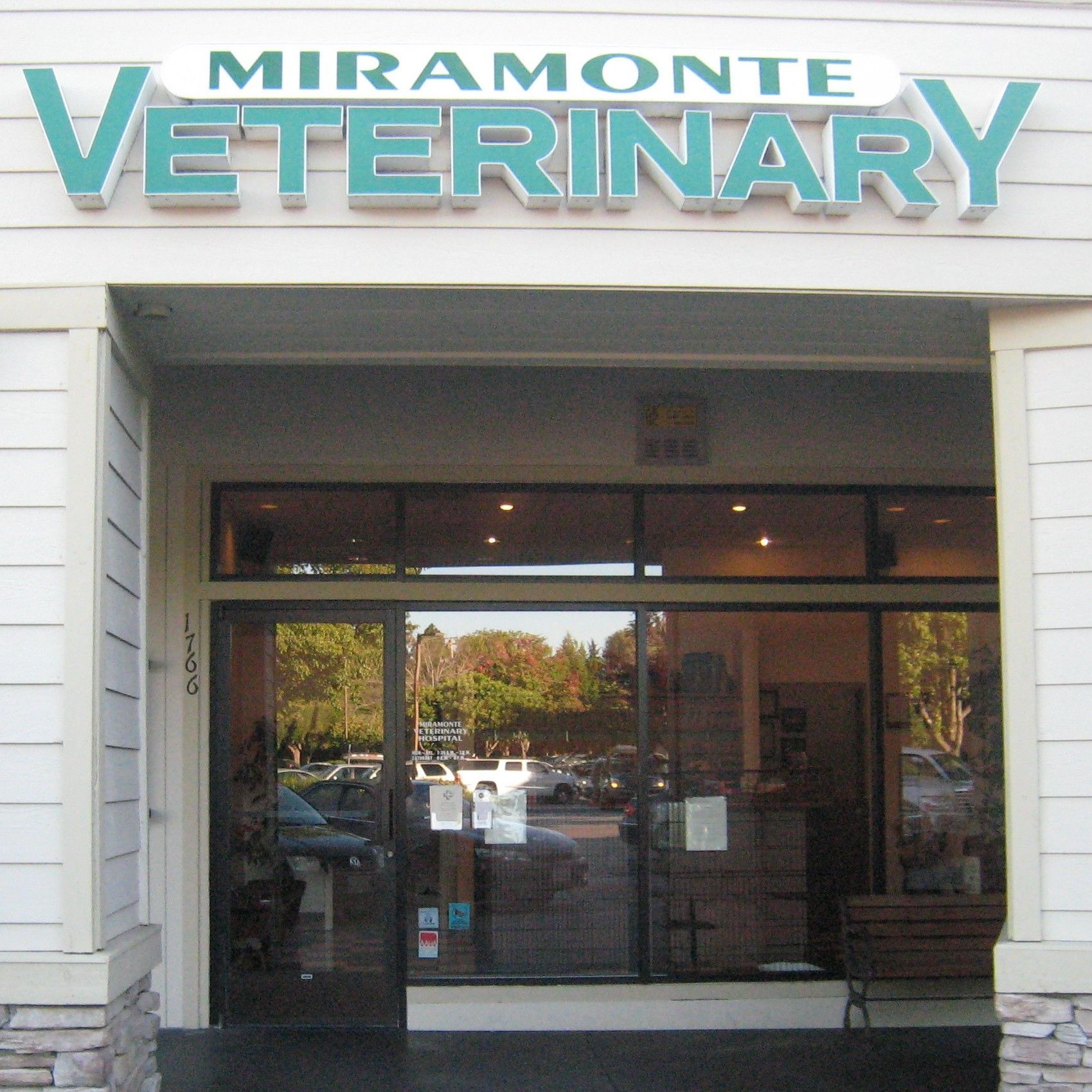 Miramonte Veterinary storefront with teal sign and glass entrance.