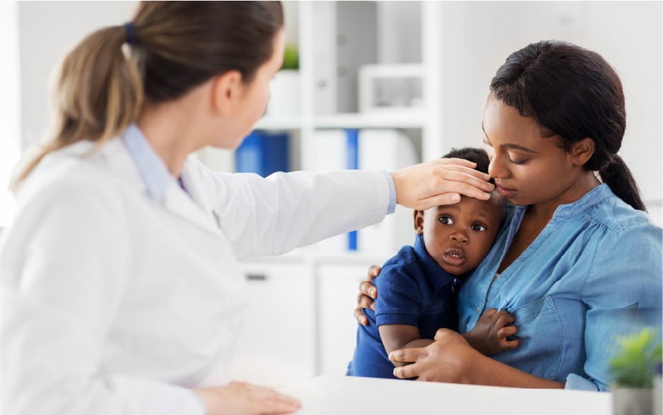 Doctor examining a crying baby while a parent holds them outdoors on a porch