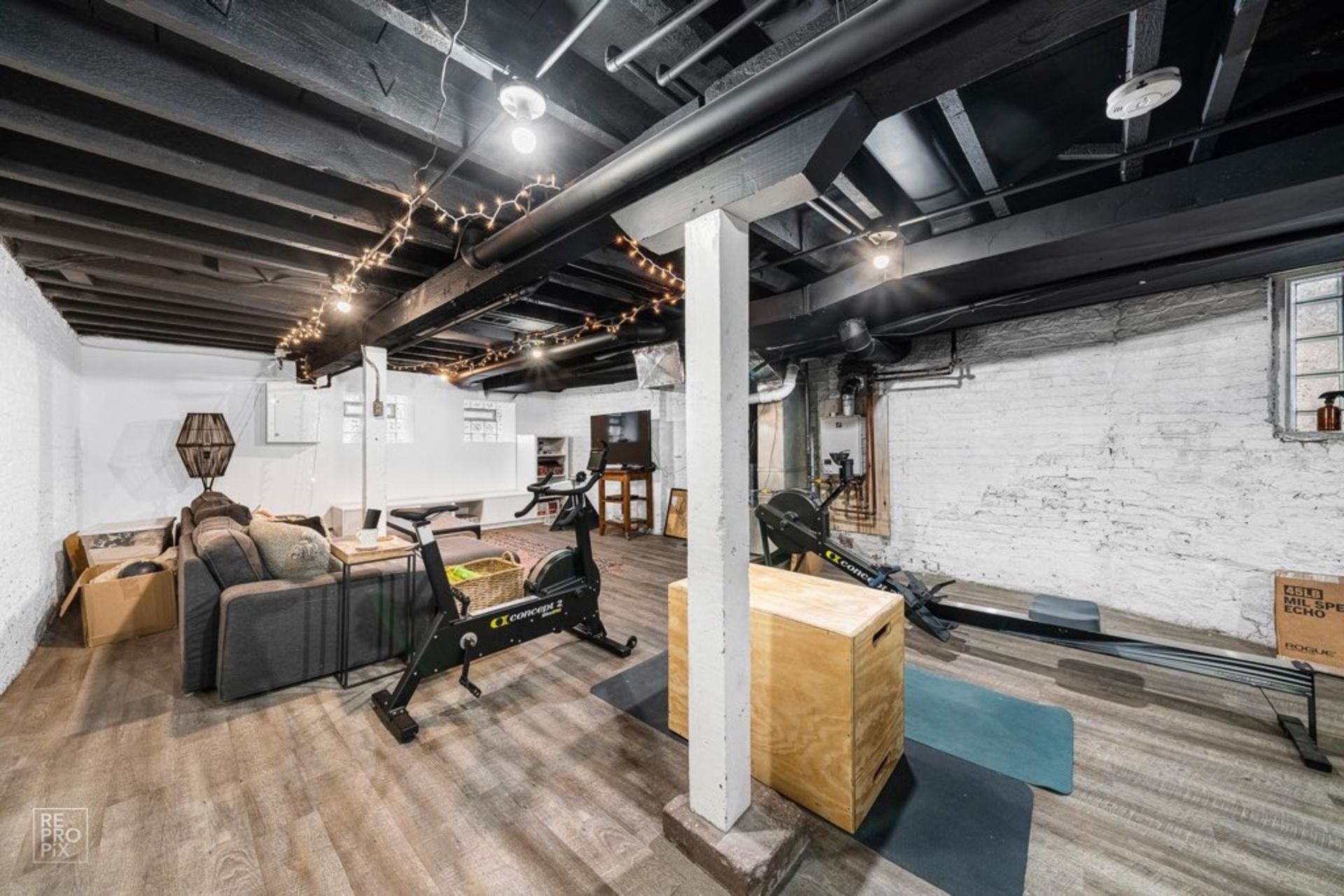 There is a living room and a gym in the basement.