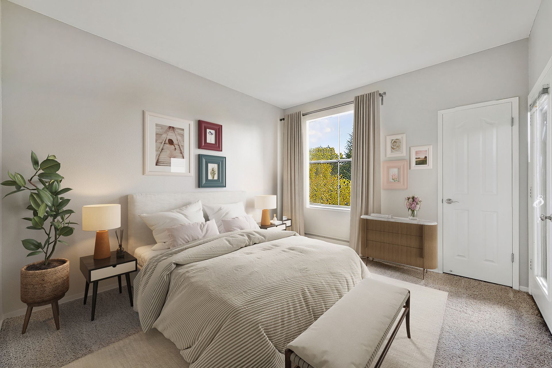 Bright bedroom in an apartment with a bed, nightstands, dresser, and large window at Rosewalk Apartment Homes in San Jose, CA.