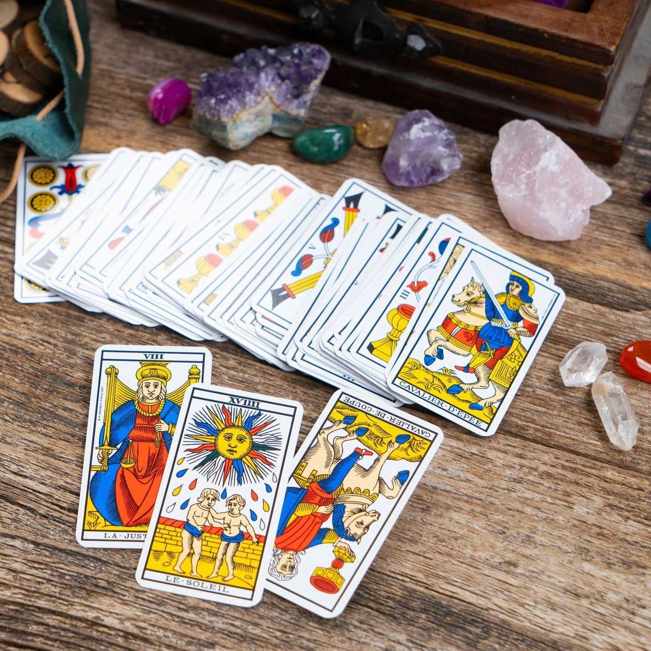 A deck of tarot cards on a wooden table A deck of tarot cards on a wooden table