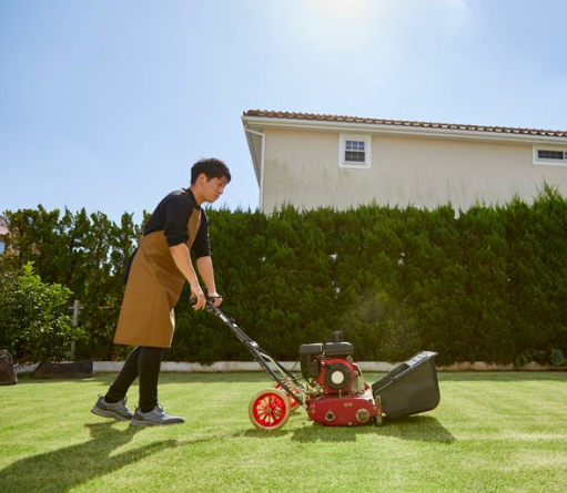 Crew mowing a residential lawn in Cambridge, Ontario