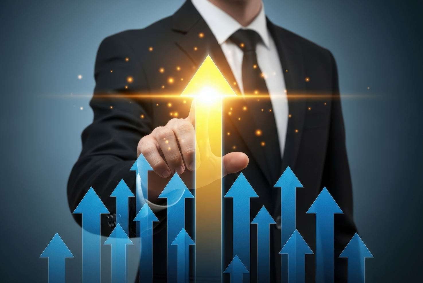 Photograph of the torso of a person wearing a suit, using their index finger to touch a glowing gold vertical, upward pointing arrow from a field of shorter, blue, vertical upward pointing arrows.