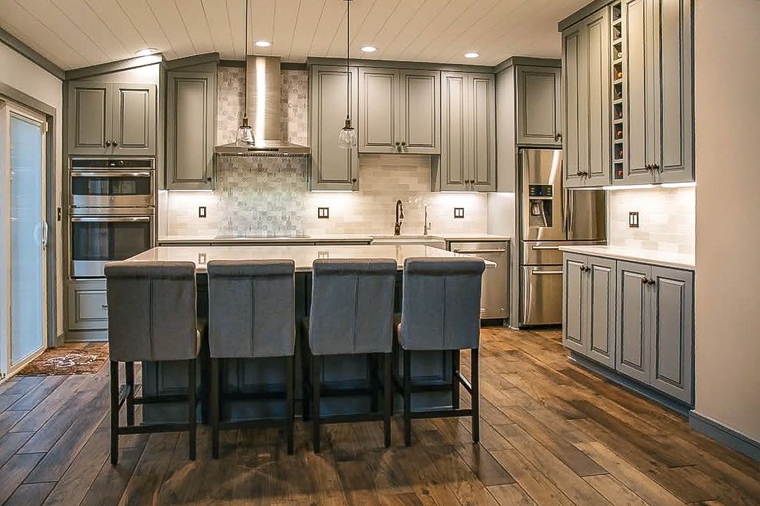 Custom gray painted and glazed kitchen cabinets.