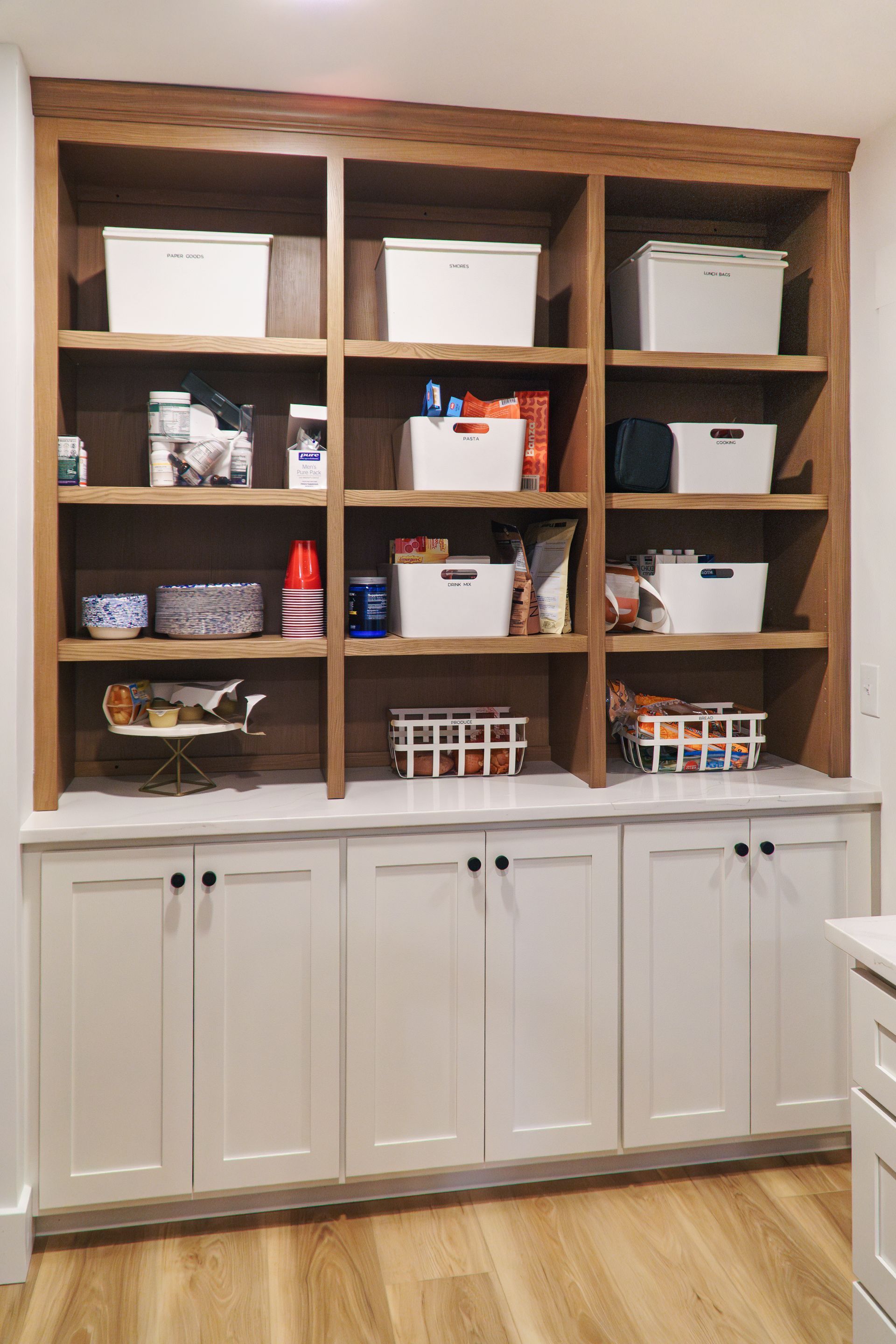 Custom wood pantry storage shelves and cabinets.
