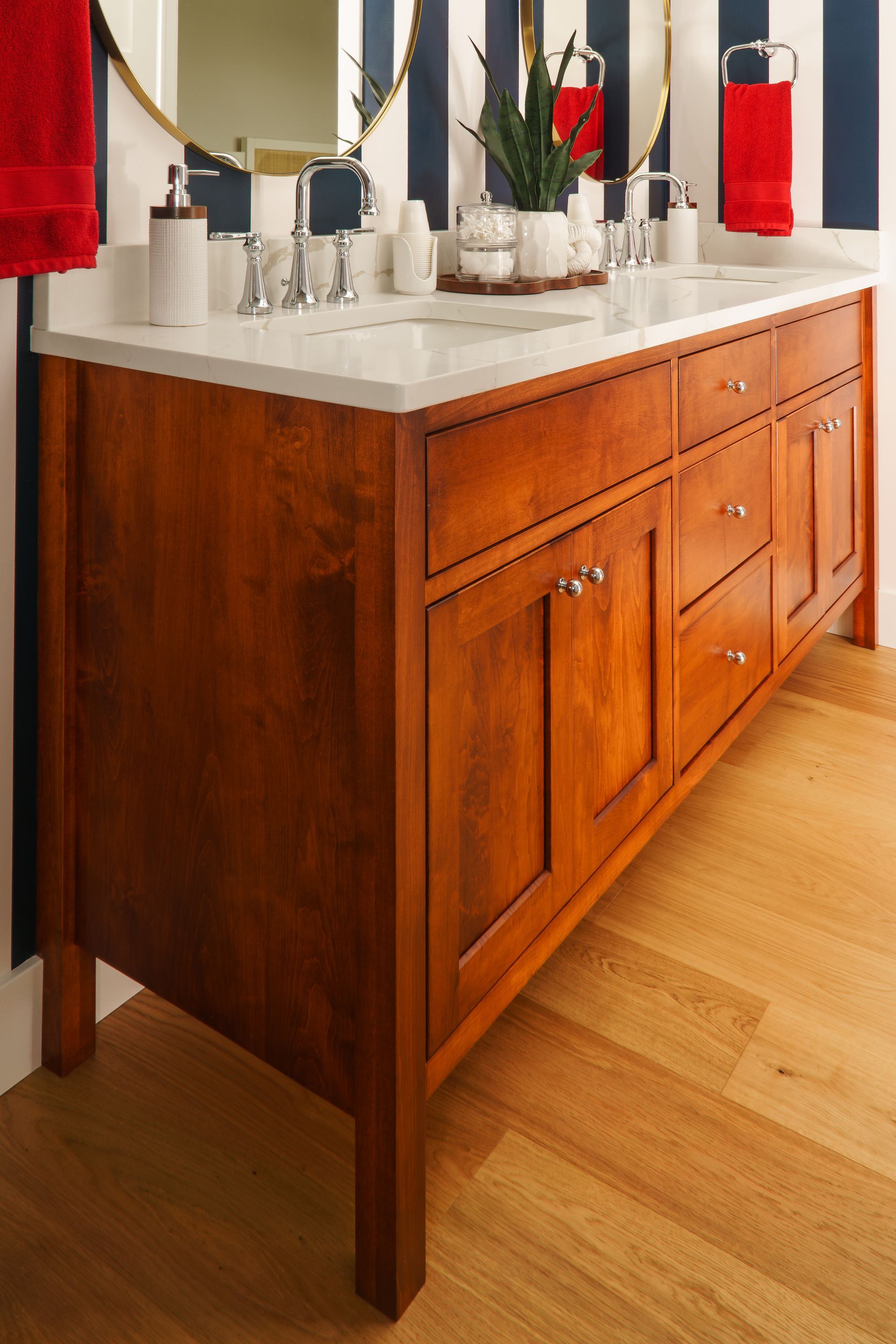 Custom maple, stained red, wood bathroom vanity with legs.