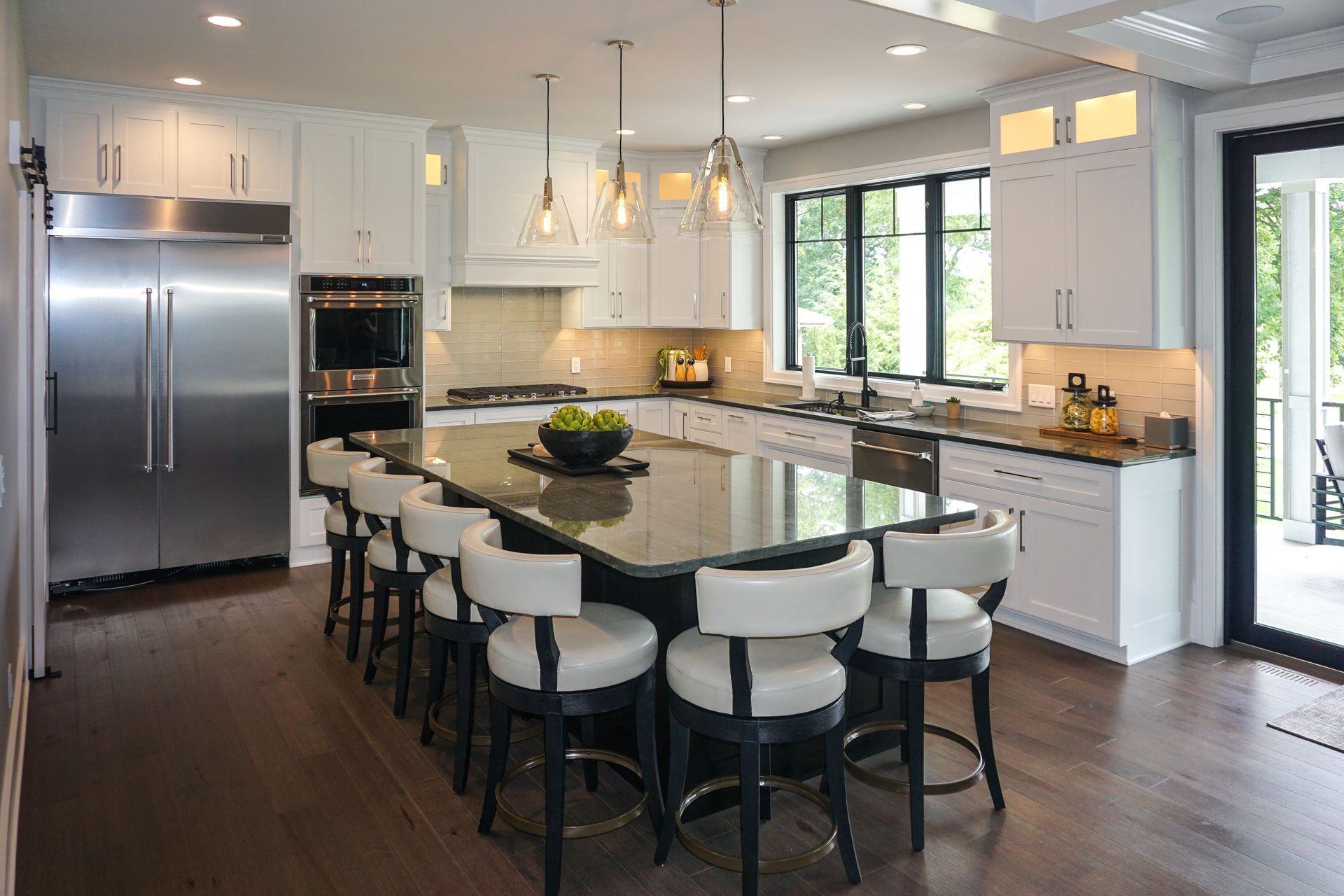 Custom white painted wood kitchen cabinets for a lovely light and airy space.