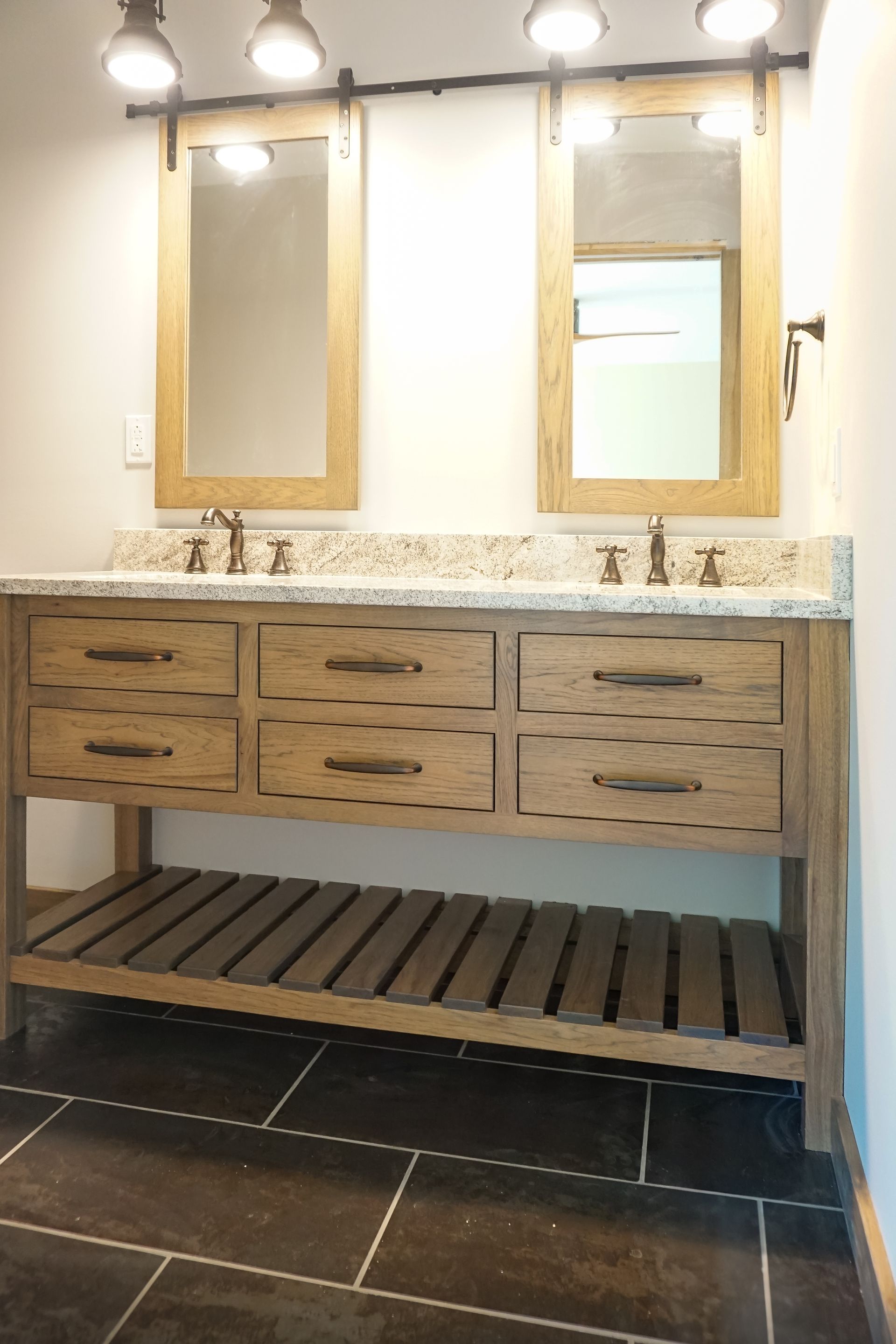 Custom stained wood bathroom vanity with open bottom.