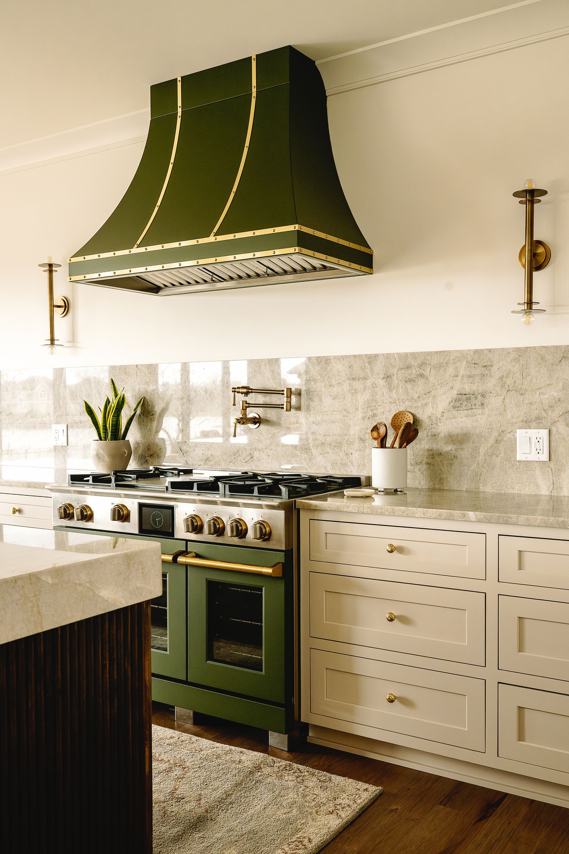 Unique green curved range hood.
