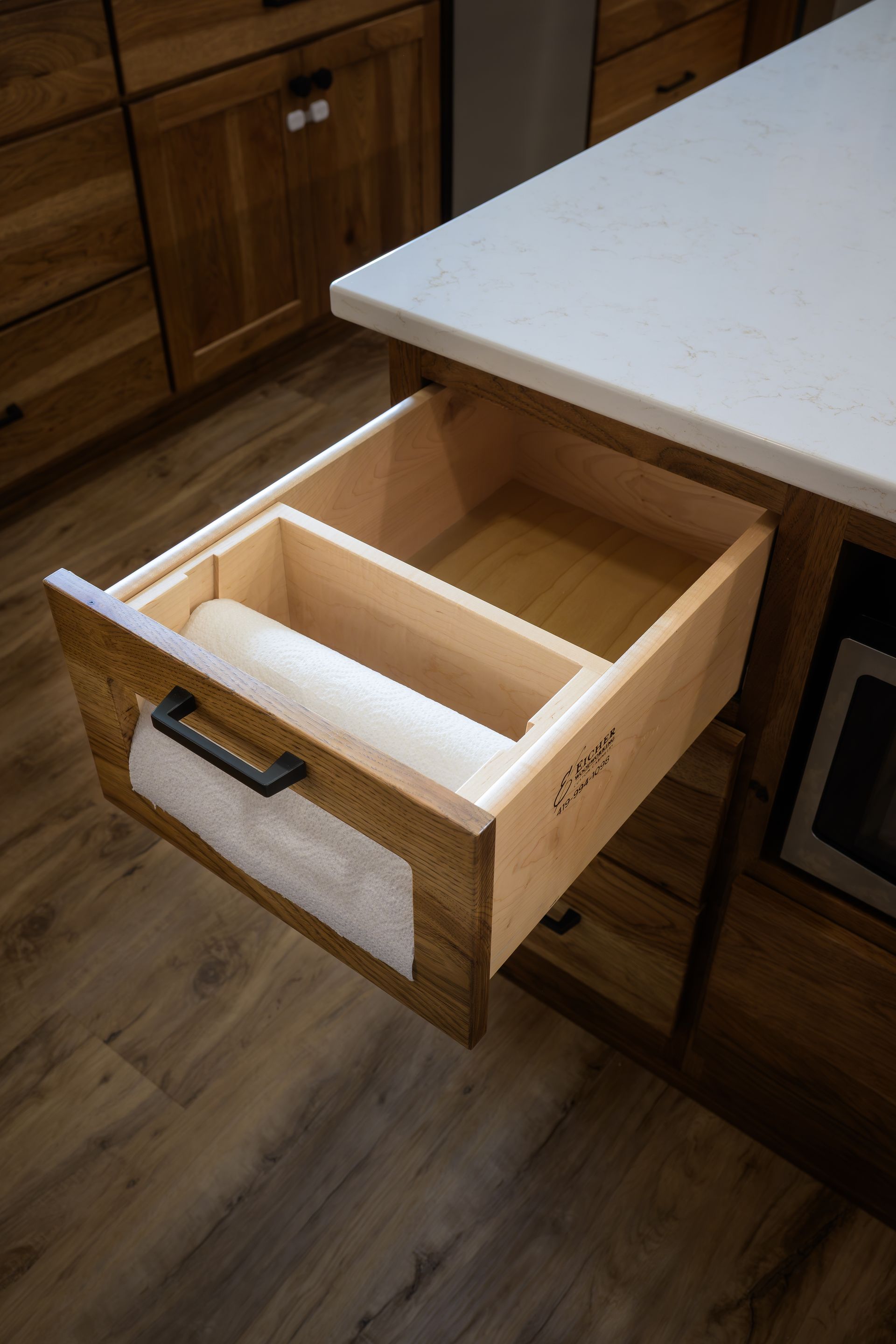 Paper towel drawer storage and dispenser.