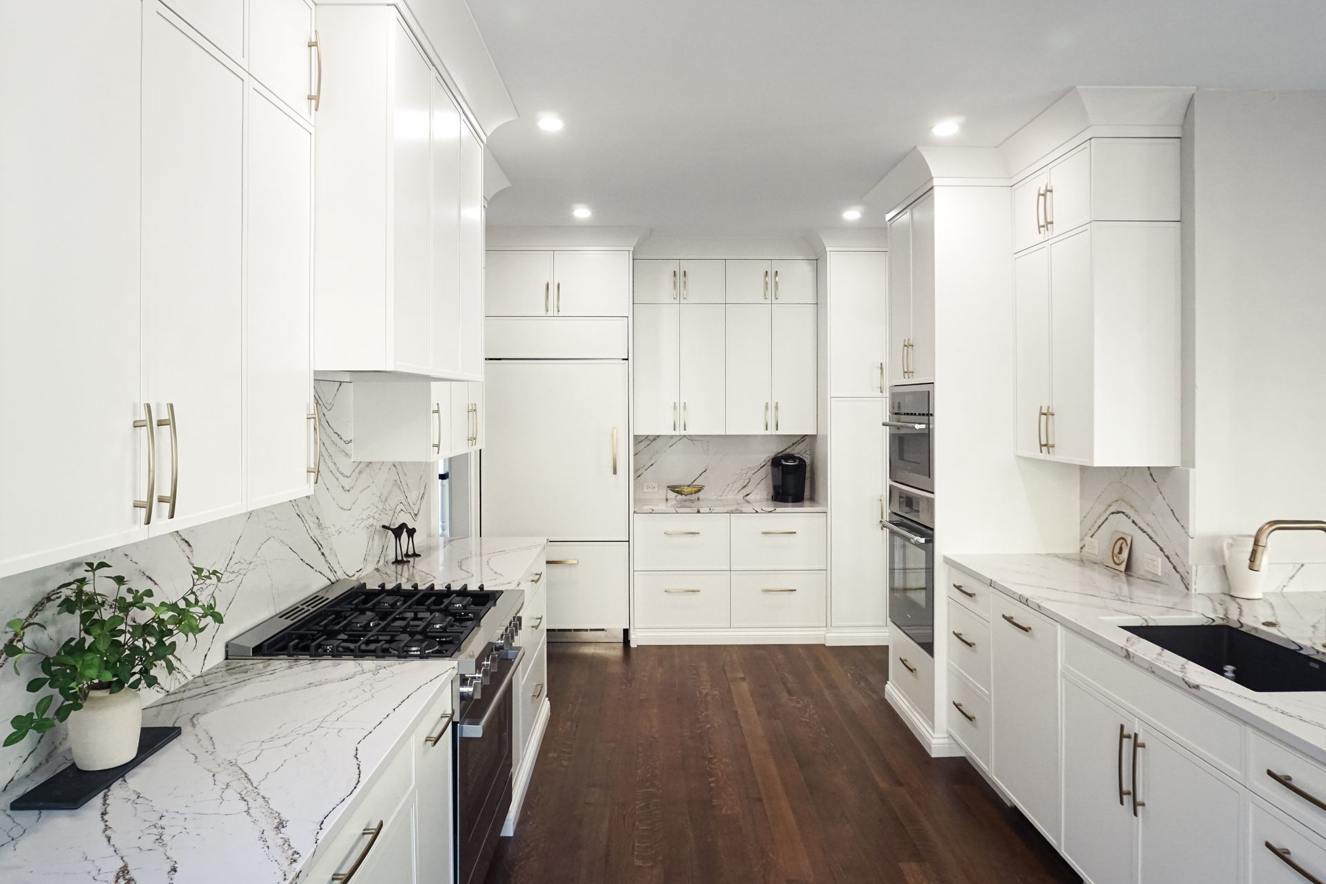 Custom white painted skinny shaker wood kitchen cabinets for a modern light look.