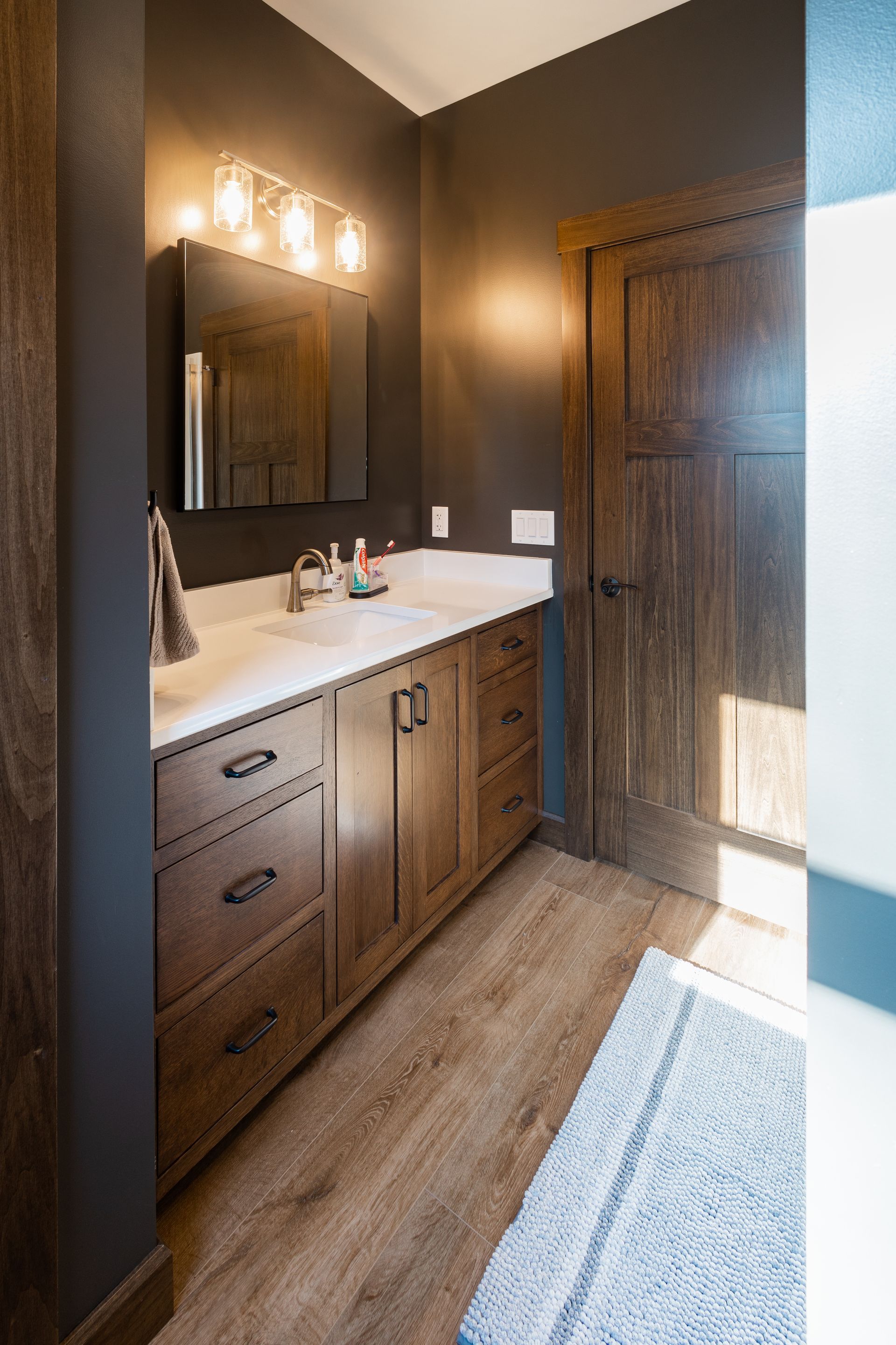 Custom quarter sawn white oak bathroom vanity and linen storage.