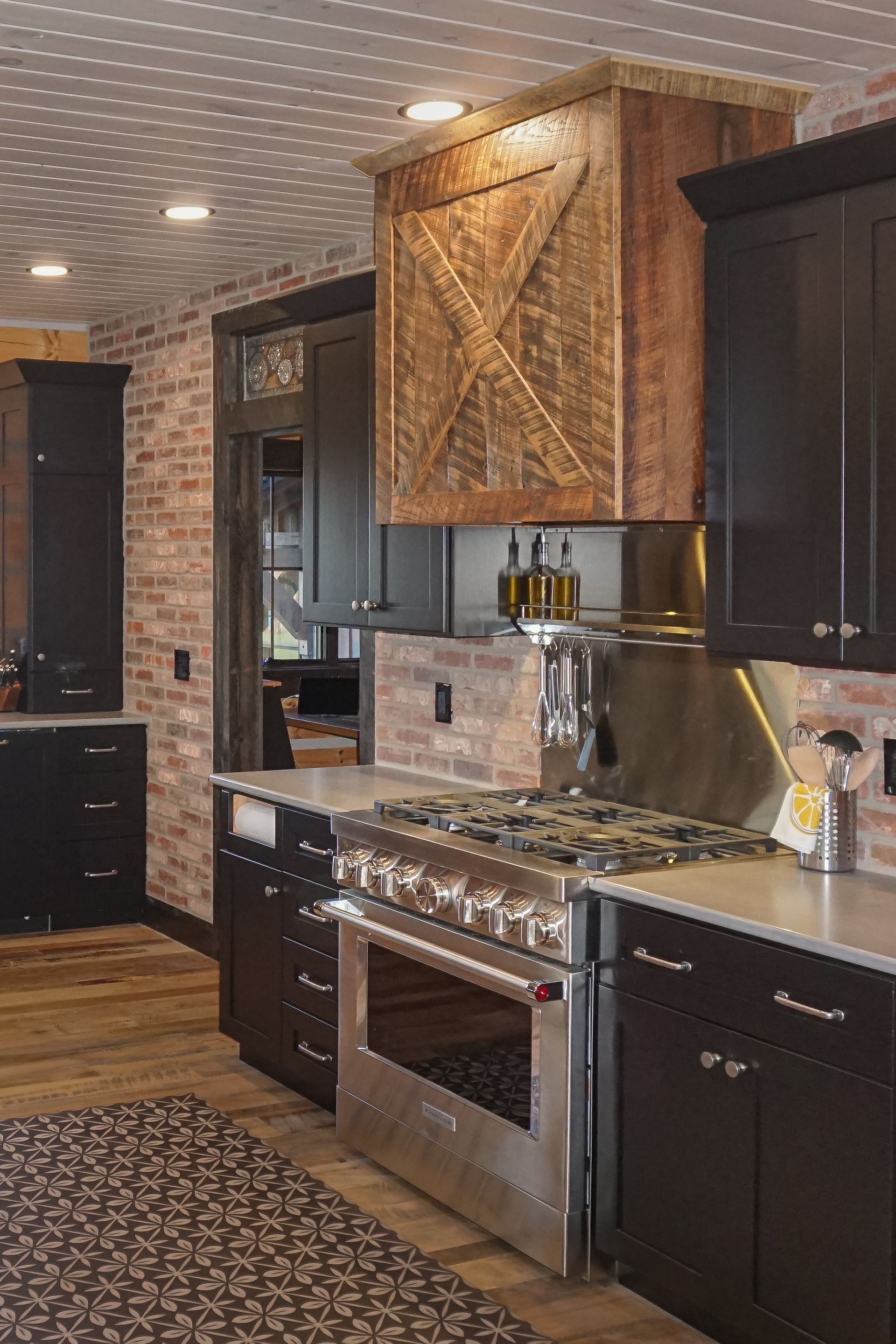 Custom rough sawn rustic wood range hood.